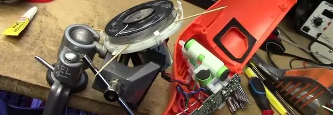 Vacuum cleaner repair parts and tools on a workbench in San Jose, CA