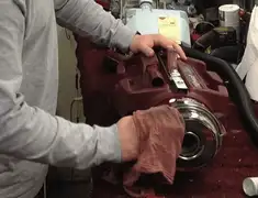 Vacuum repair technician cleaning and servicing a vacuum motor in San Jose, CA